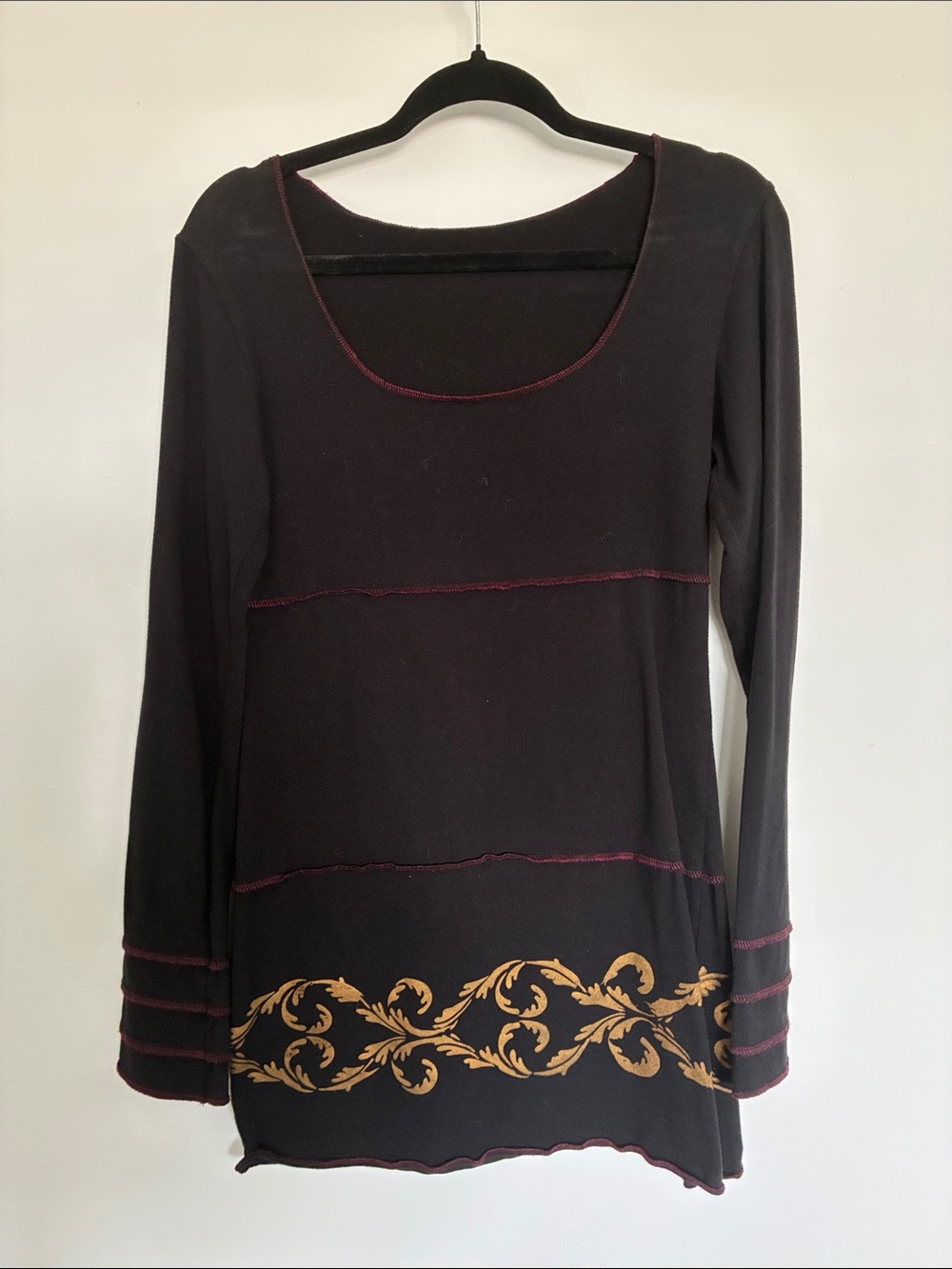 Black Long-Sleeve Mini Dress with Gold Scroll Accent